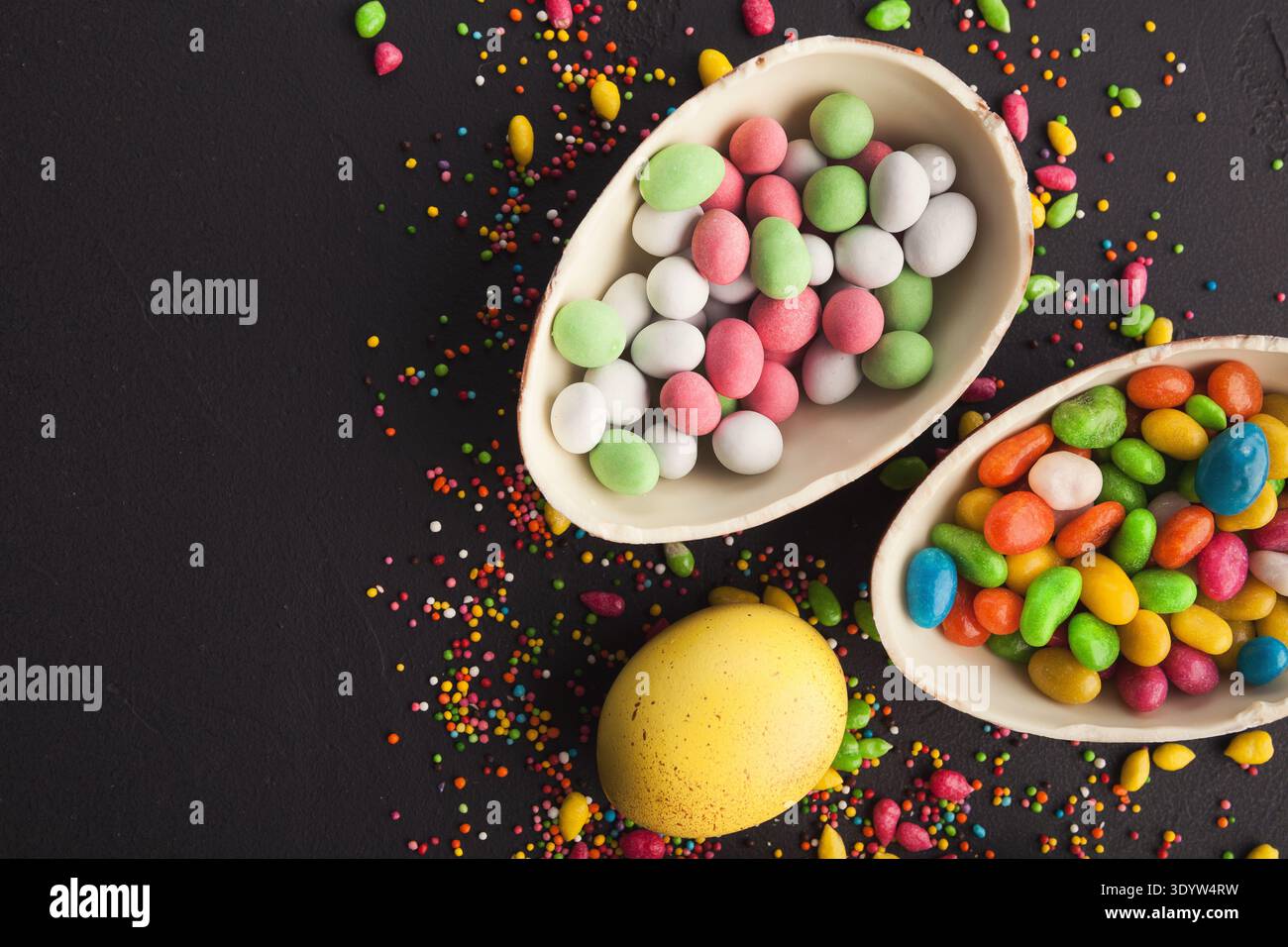 Chocolate eggs and colorful candies Stock Photo