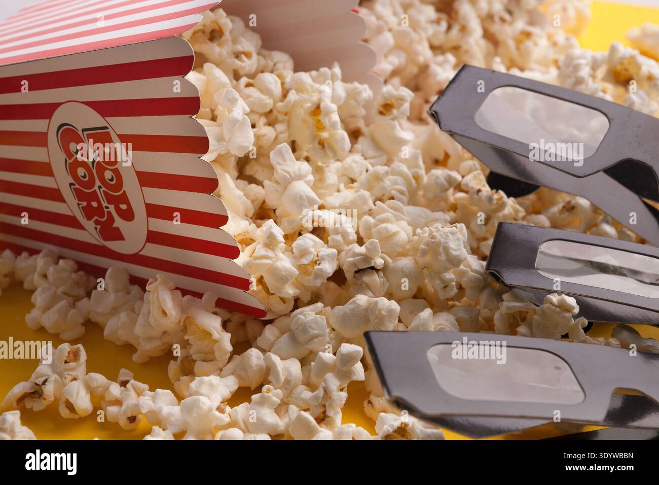 3D glasses and popcorn on red background Stock Photo