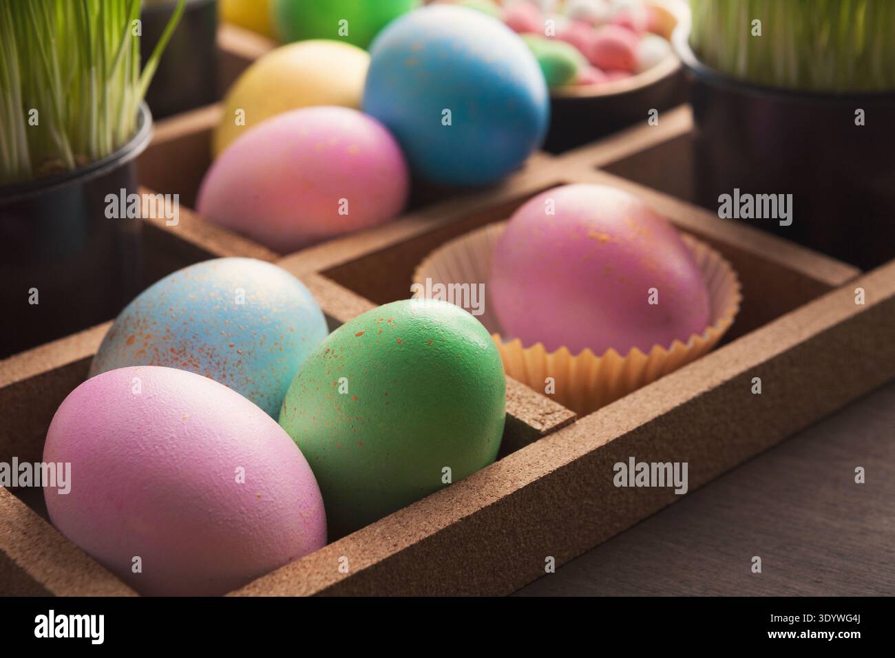 Easter eggs in wooden container Stock Photo