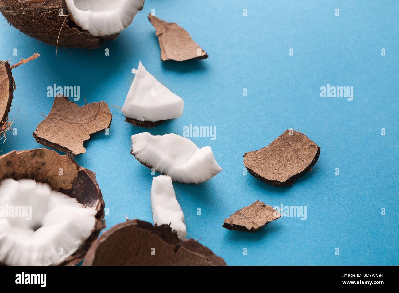 Closeup healthful coconuts on a light blue background Stock Photo