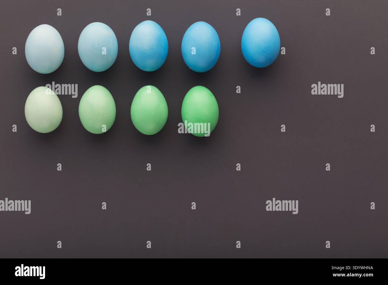 Easter background. Colored eggs on gray background Stock Photo