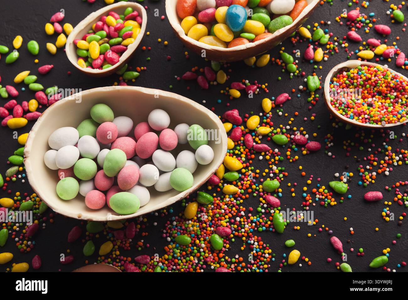 Chocolate eggs filled with sweets Stock Photo