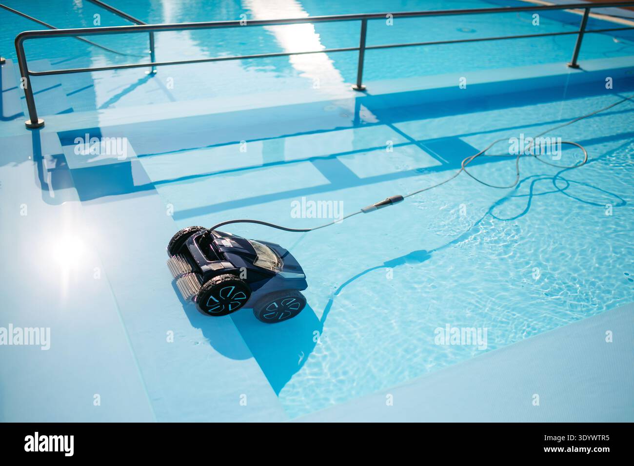 Pool Cleaner Working Robotic pool cleaner working underwater to keep swimming pool clean ...