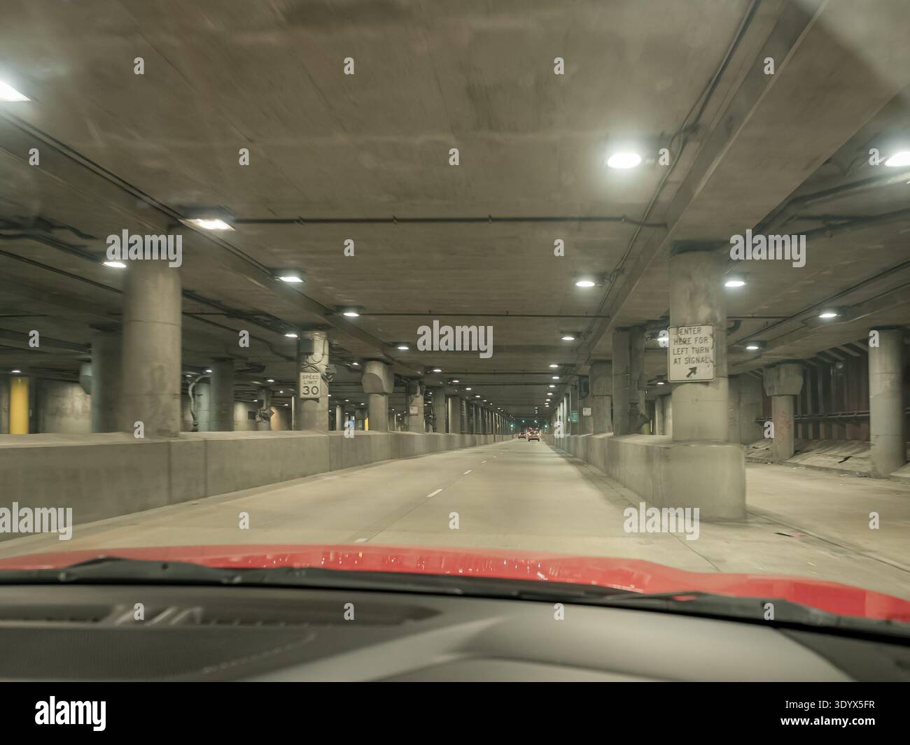 POV driving through Lower Wacker Drive in Chicago at night, showing the ...