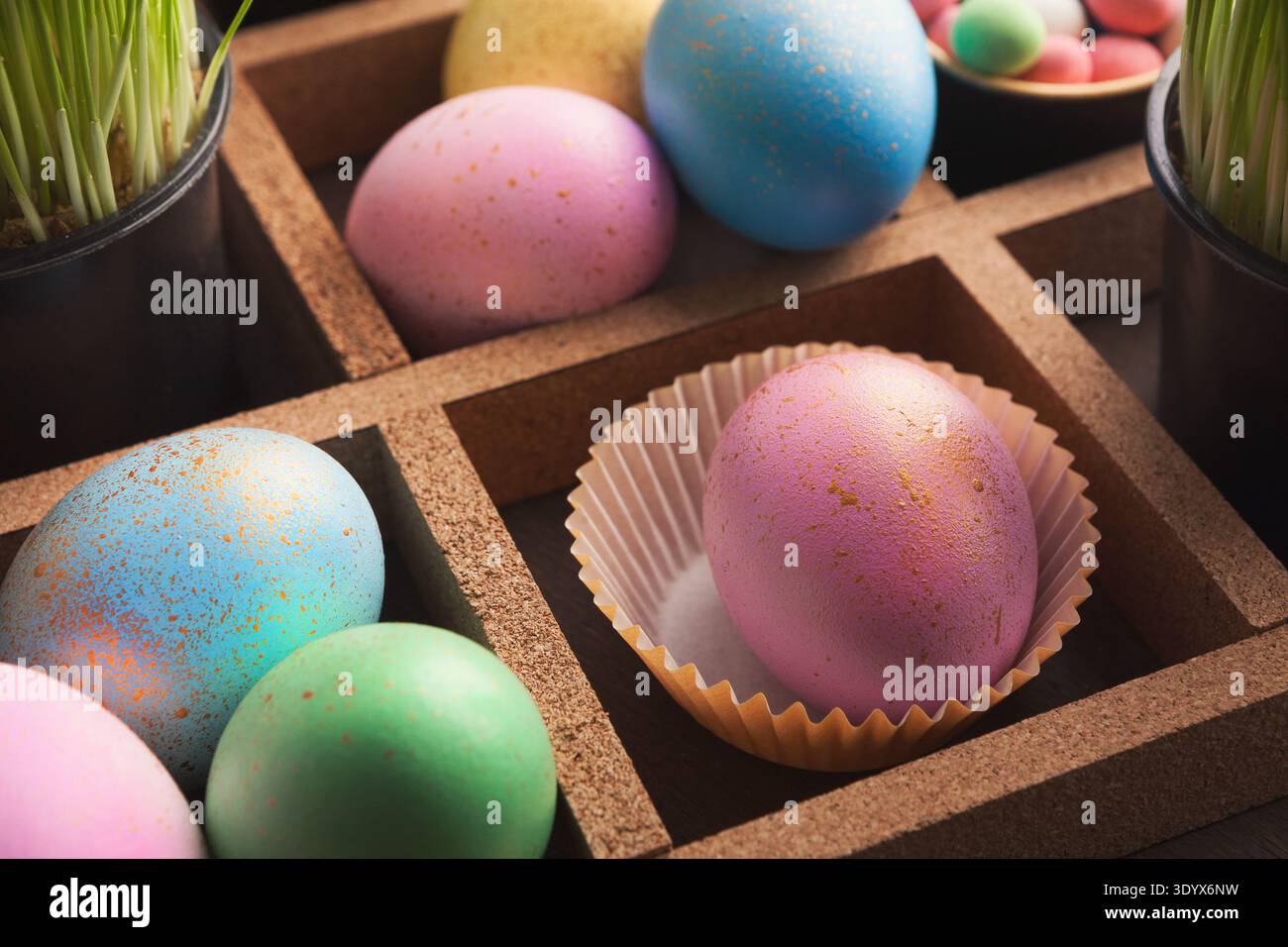 Easter eggs in wooden container Stock Photo