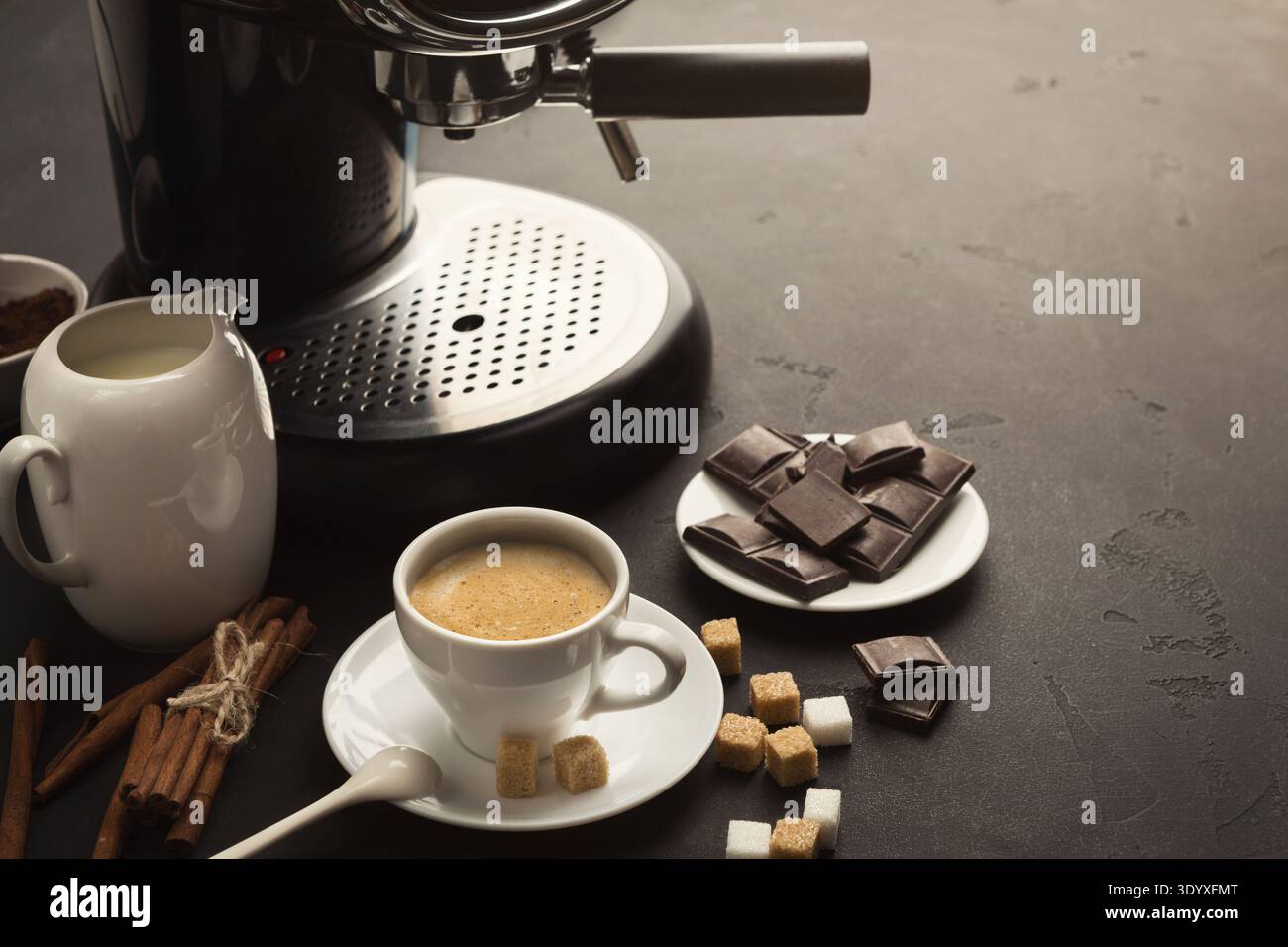 Coffee cup and sweets on black table Stock Photo