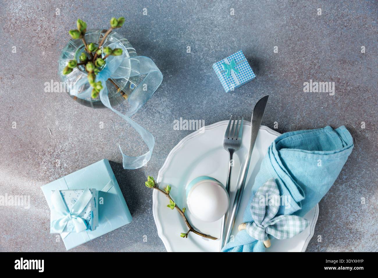 Spring Celebration Setting with Soft Blue Decor.. Stock Photo
