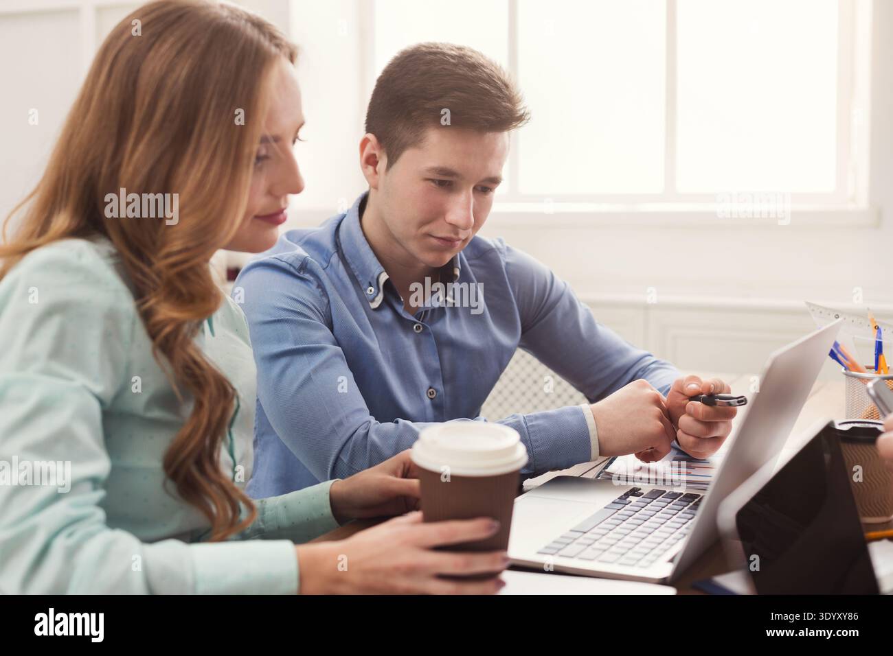 Programmers working in software developing company Stock Photo