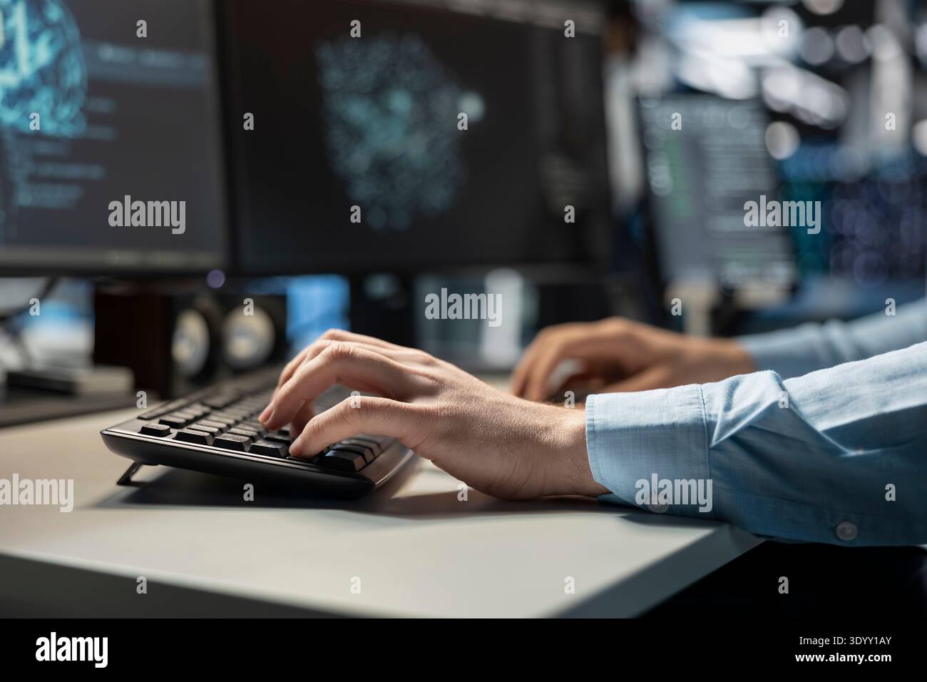 Close up of data center technician coding on PC to update server tech, configuring equipment using software tools. Server room employee types on computer keyboard, ensuring reliable network operations Stock Photo