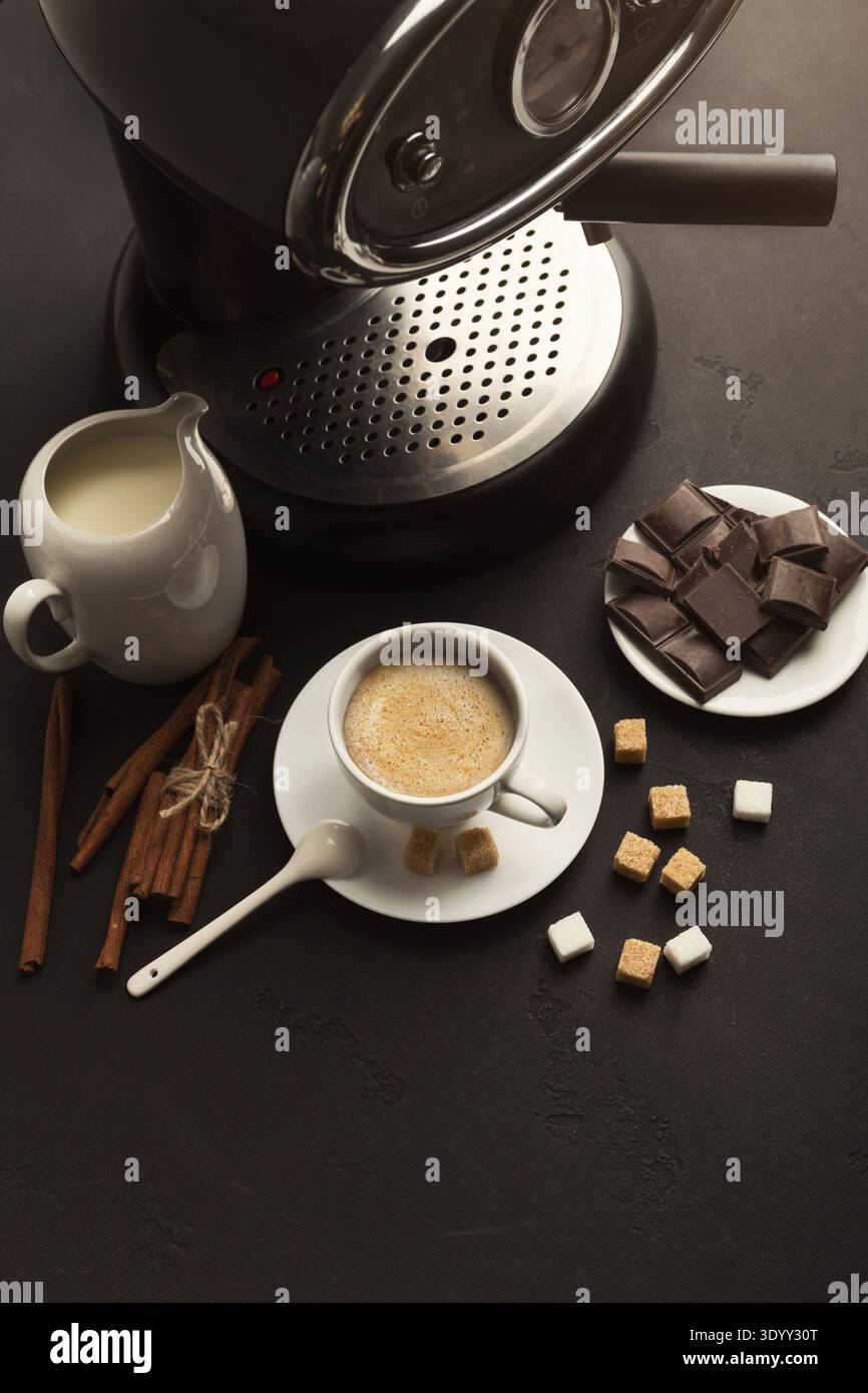 Coffee cup and sweets on black table Stock Photo