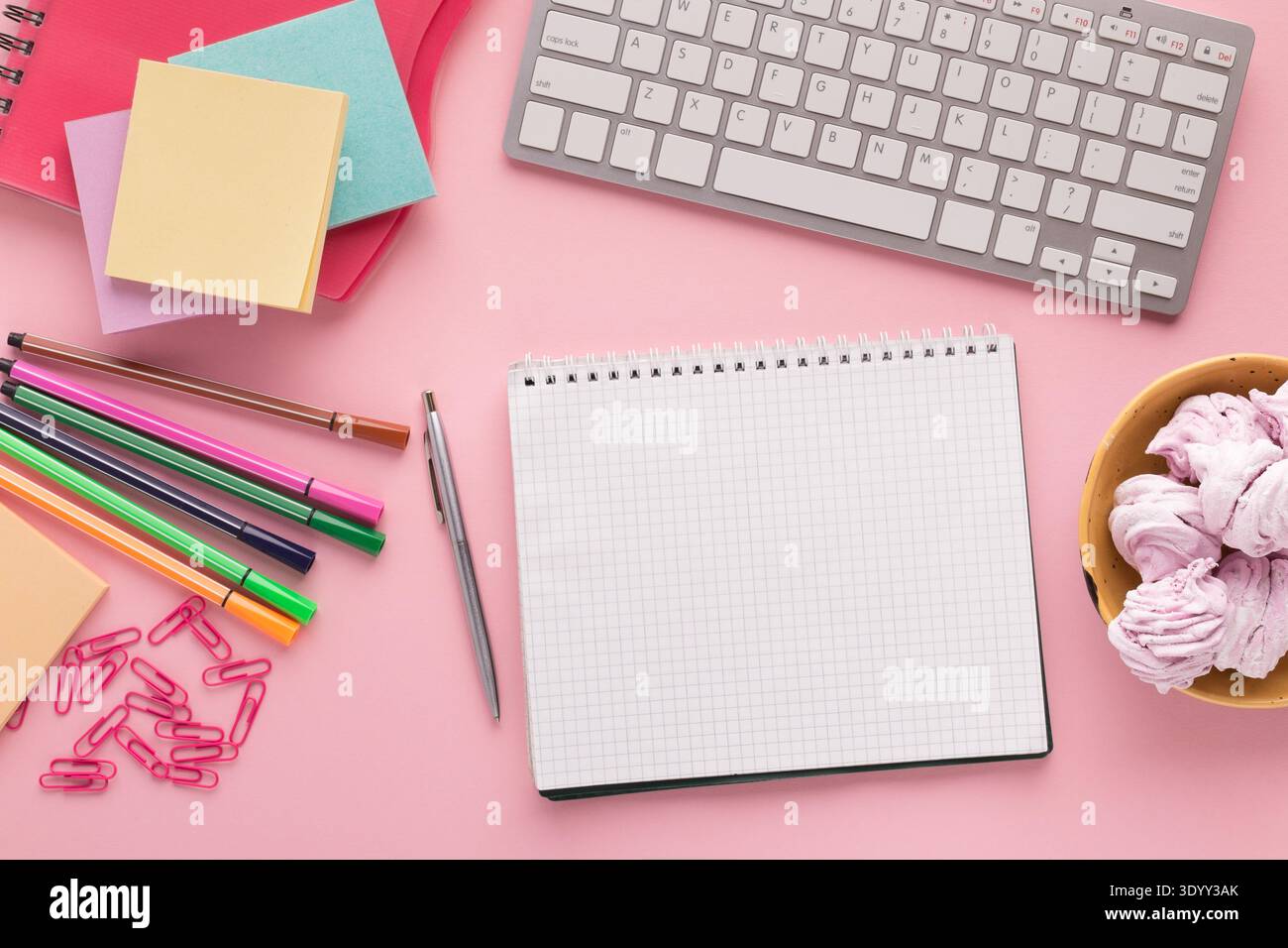 Spiral notepad on pink background, top view Stock Photo