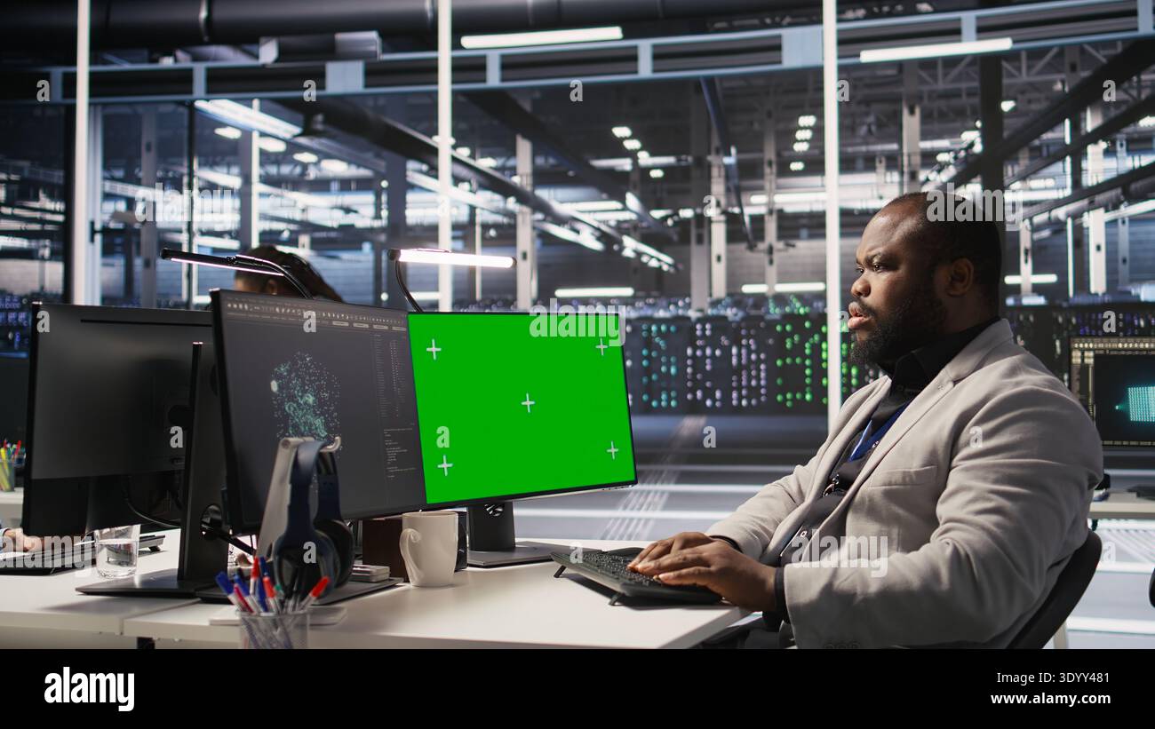 Data center admin using isolated screen PC to monitor neural network AI ...