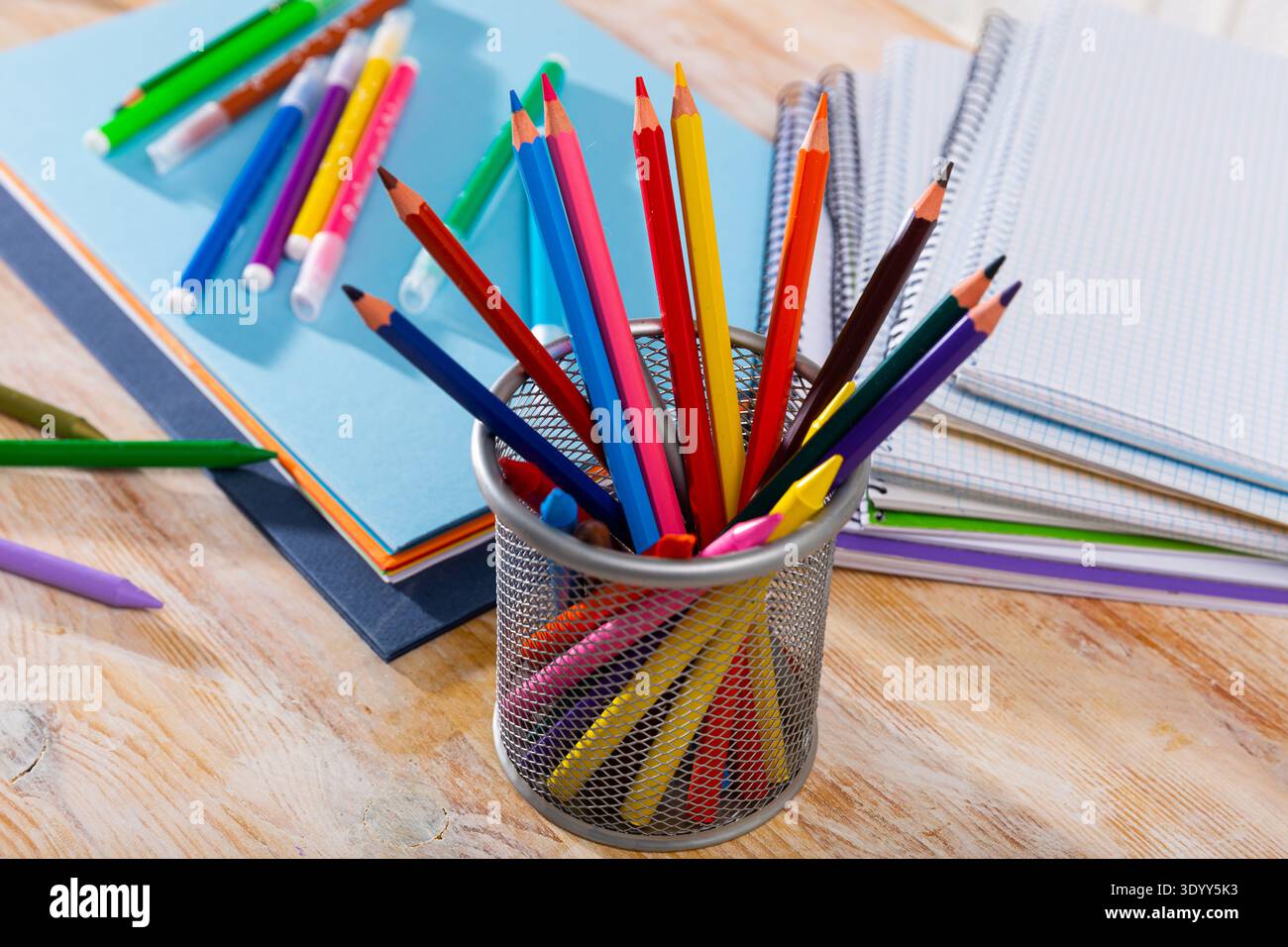 Colored pencils kept in pencil holder Stock Photo
