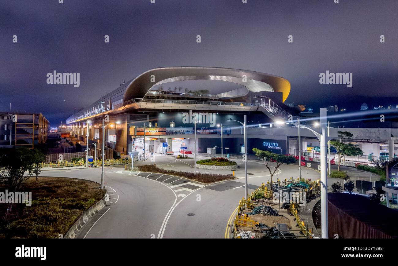 The Kai Tak Cruise Terminal at the site of the old Kai Tak Airport Runway in Kowloon, Hong Kong, at night Stock Photo