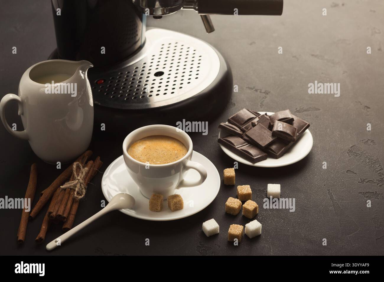 Coffee cup and sweets on black table Stock Photo