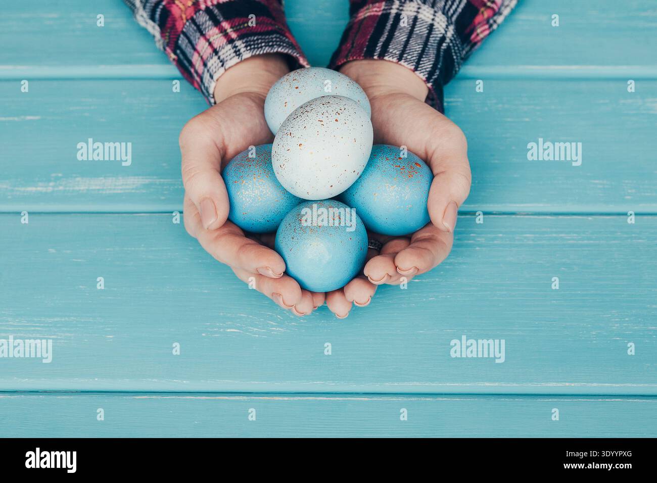 Female hand holding Easter eggs in hands Stock Photo