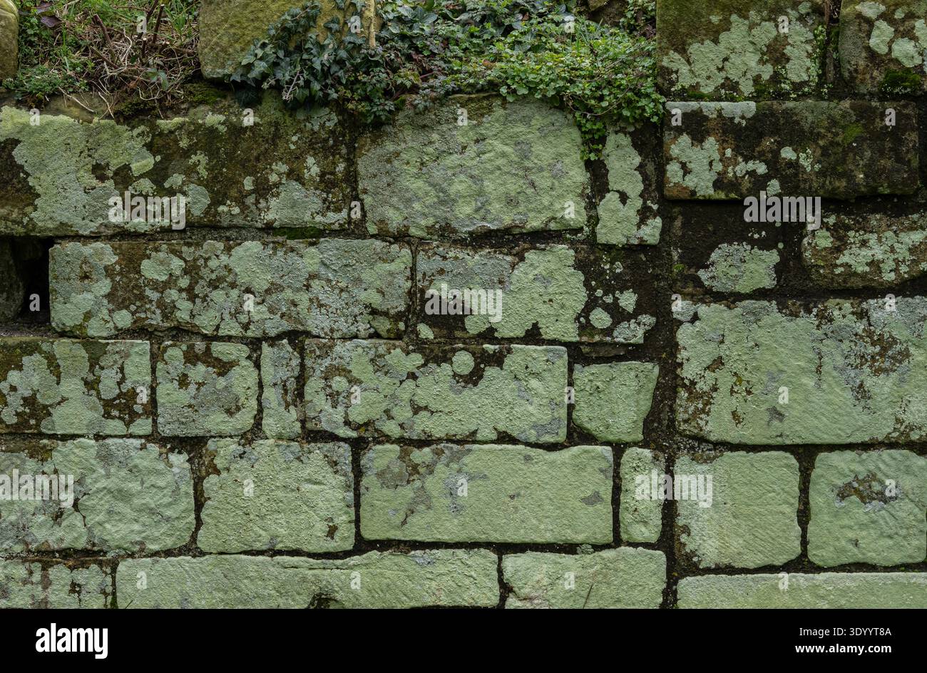 Ancient limestone block wall texture with natural stone masonry pattern Stock Photo