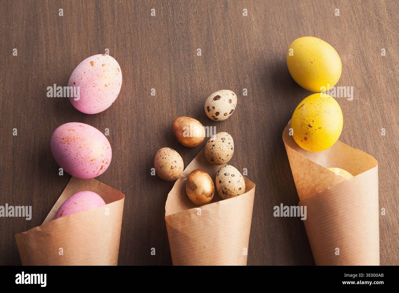 Easter composition with eggs in craft paper cornets Stock Photo