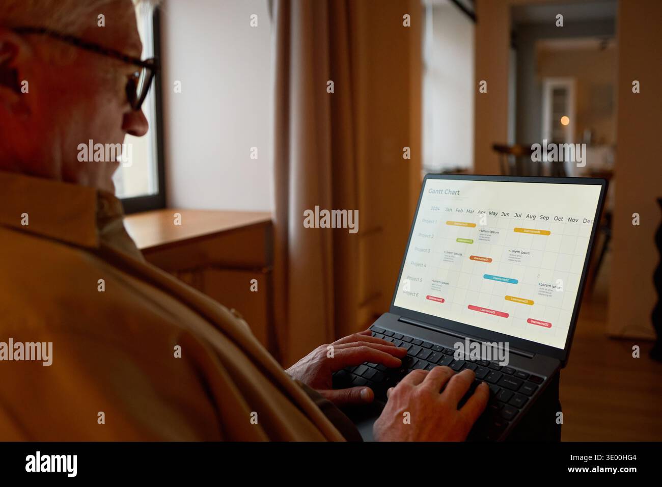 Senior Caucasian Man Using Laptop While Planning Schedule at Home Stock Photo