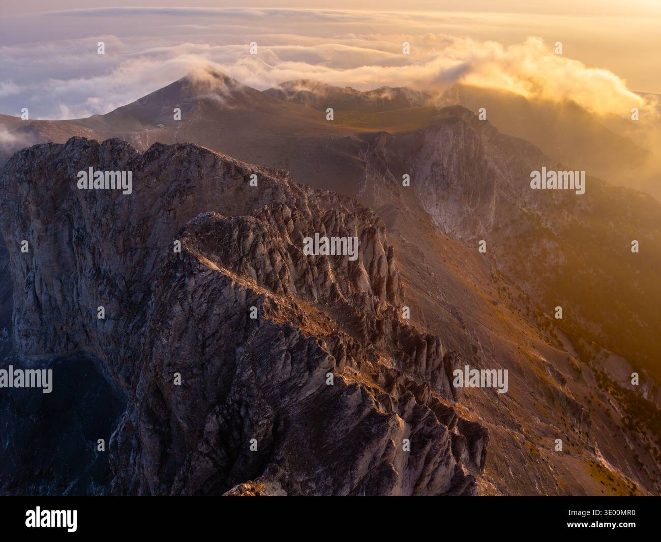 Sharp Ridges Head Aerial view of sharp, rocky ridges reaching for the sky, partially ...