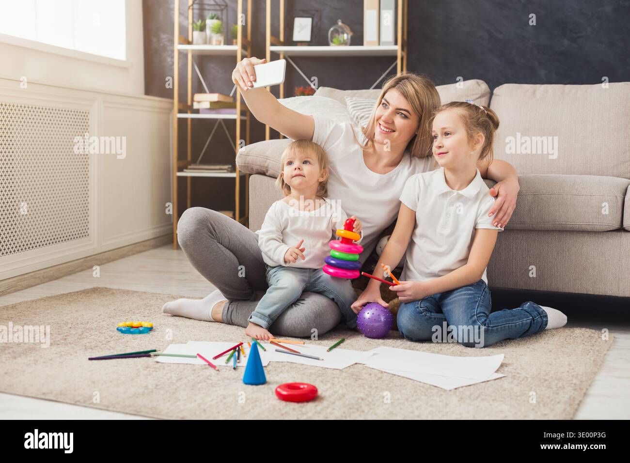 Happy mother spending time with her daughters Stock Photo