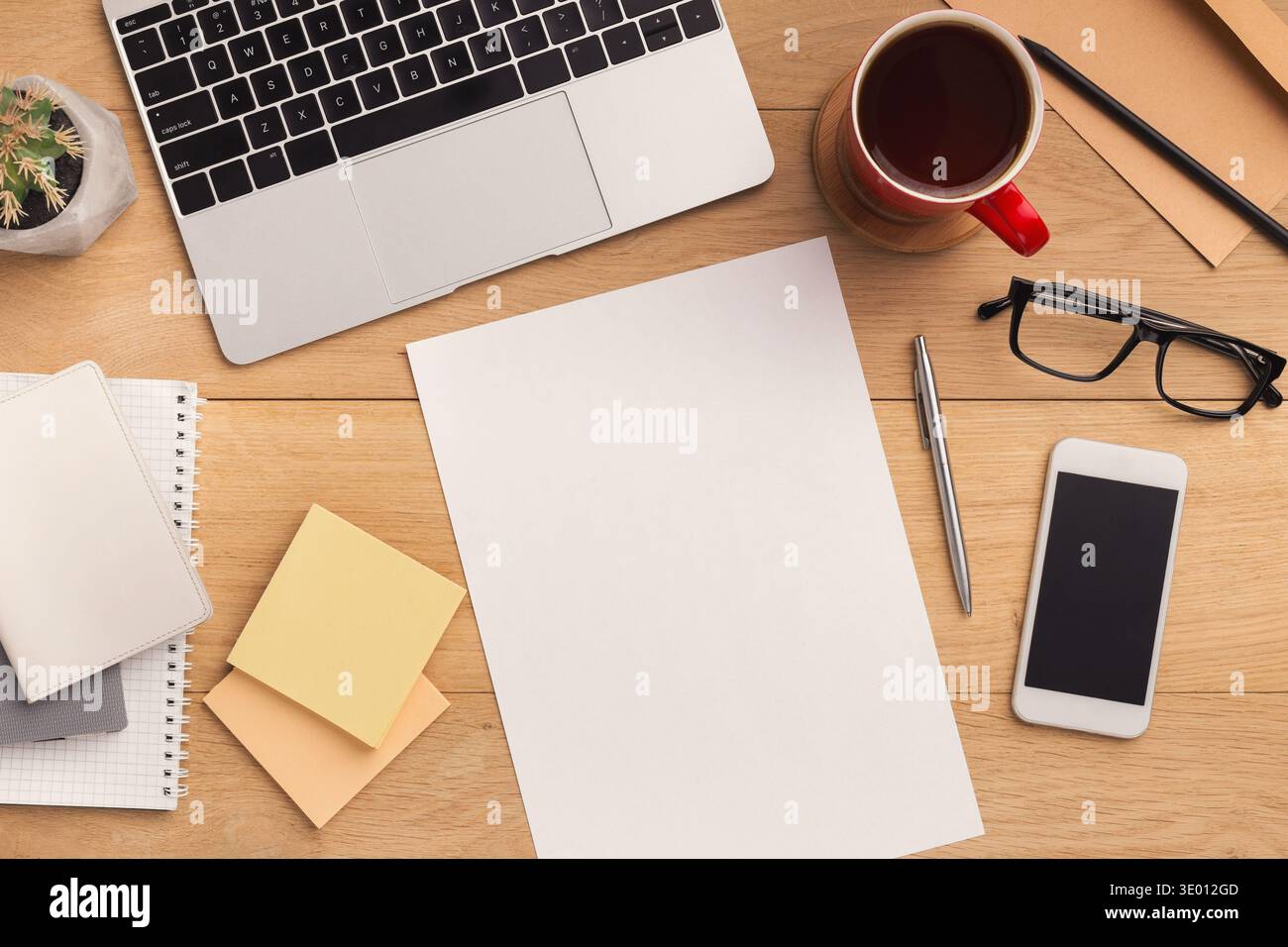 Wooden table with empty paper top view Stock Photo