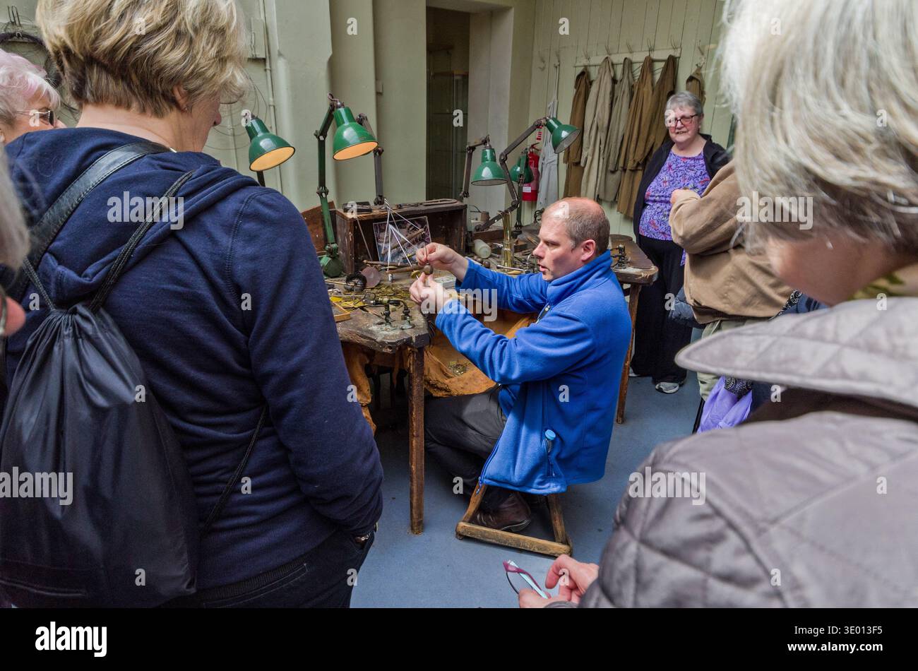 Staff member demonstrating jewellery making to a group of seniors, Museum of the Jewellery Quarter, Birmingham, UK Stock Photo