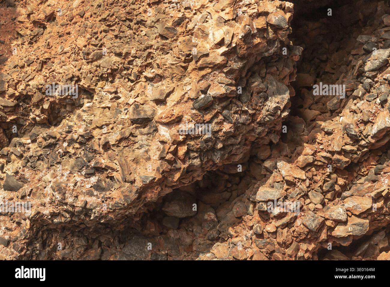 Natural rock cliff texture with layered stones and rough geological ...