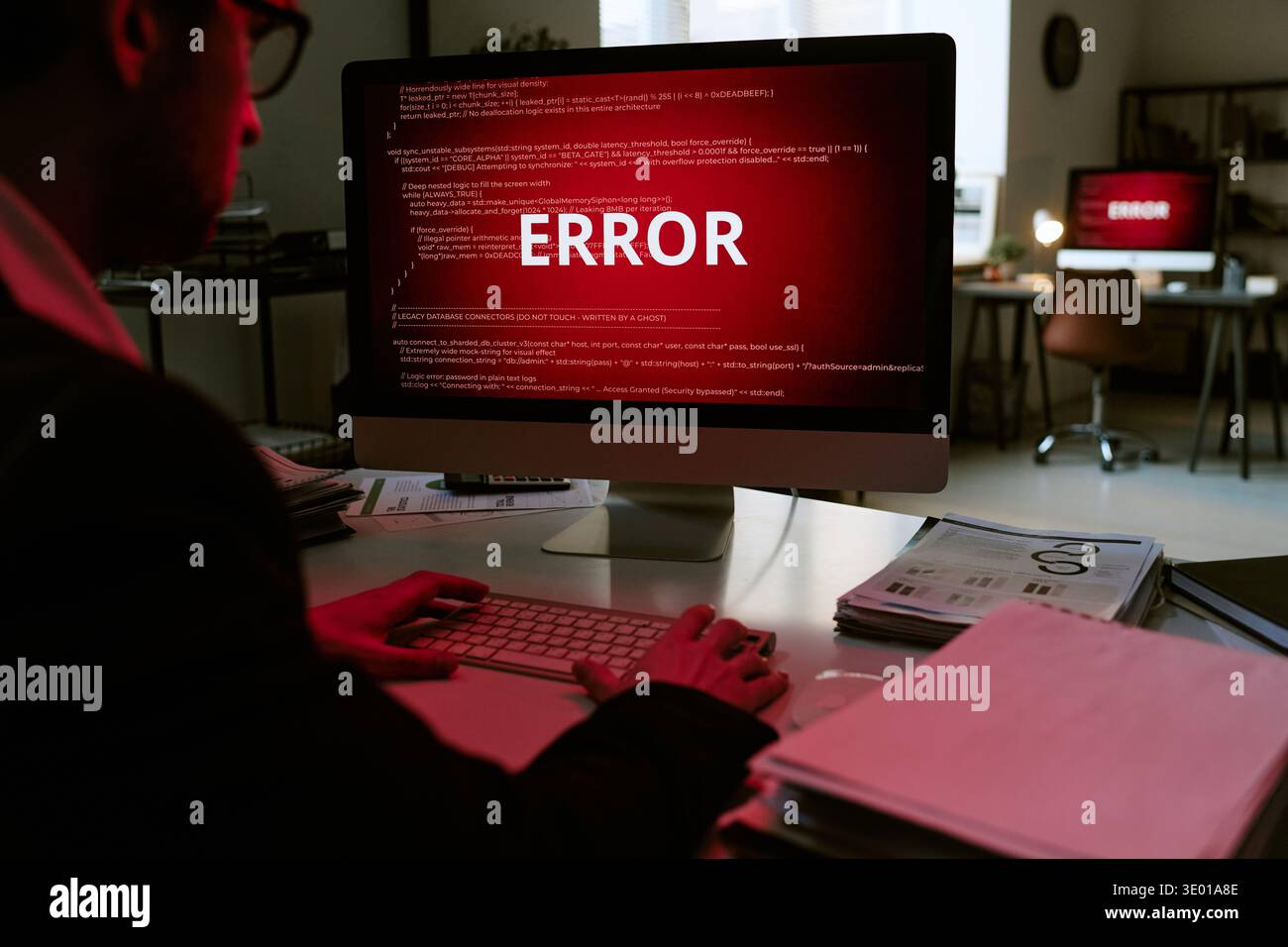 Young Adult Caucasian Man Working on Computer Displaying Error Message Stock Photo