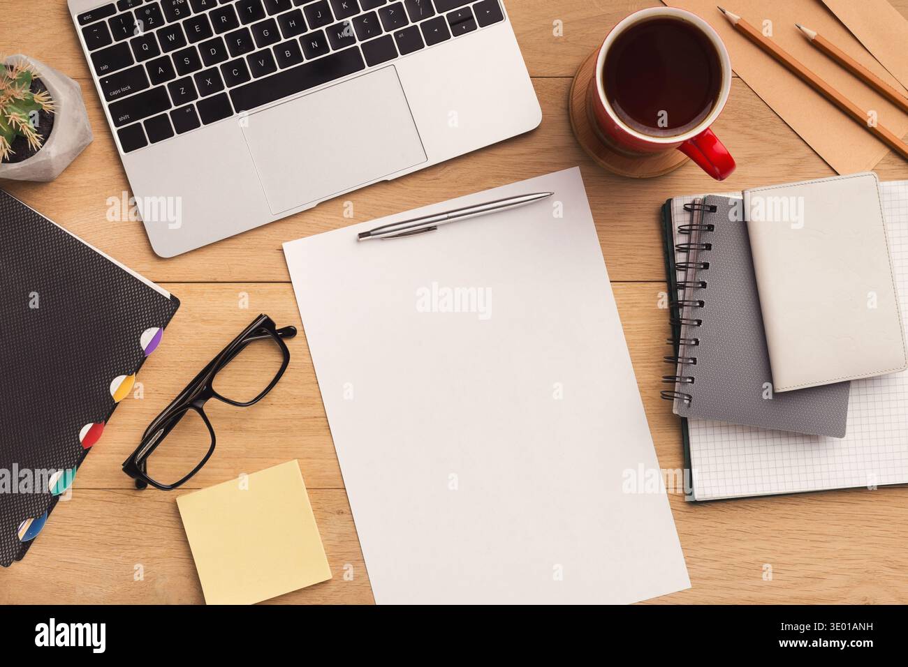 Wooden table with empty paper top view Stock Photo