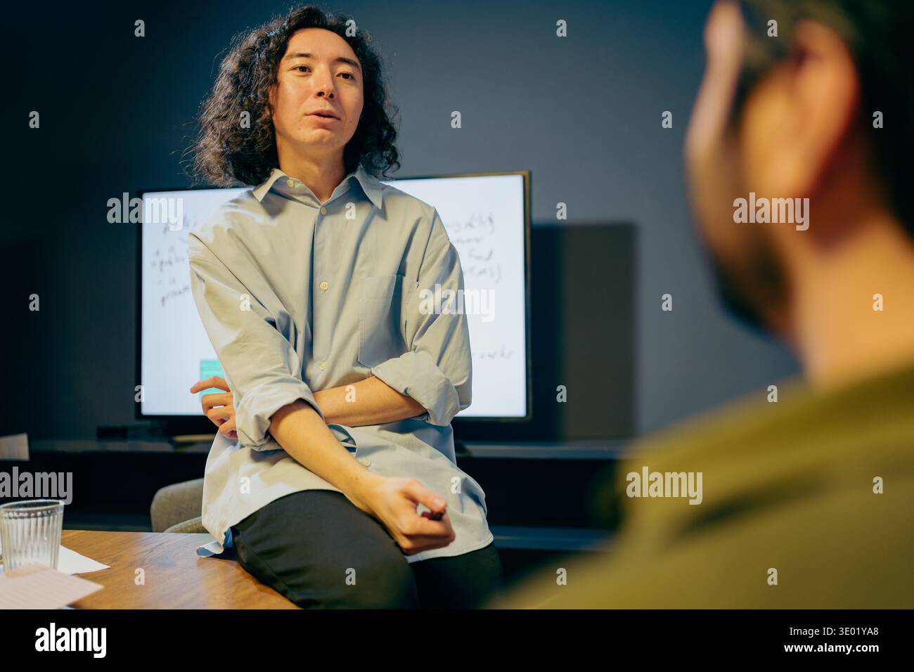 focused discussion around strategy, individuals deeply analyzing ideas during collaborative meeting Stock Photo