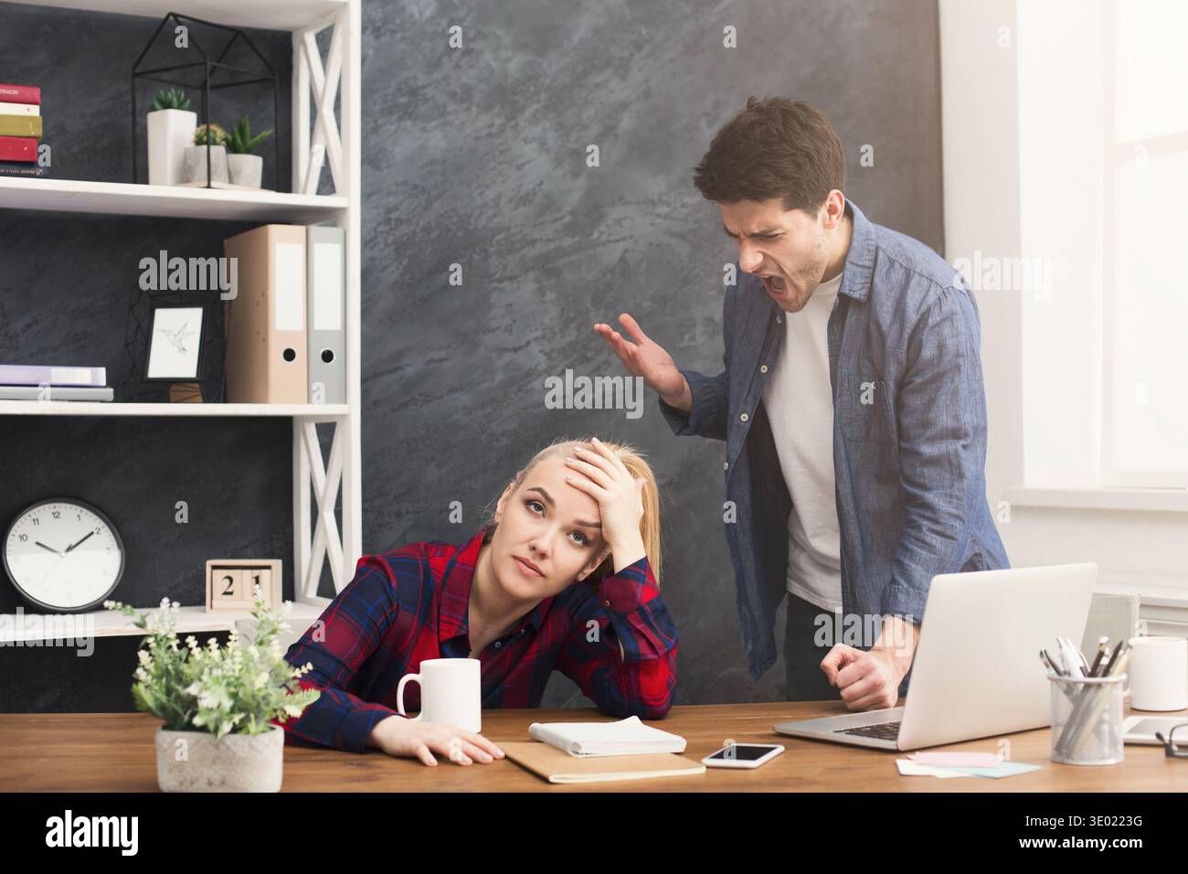 Emotional colleagues arguing at office Stock Photo