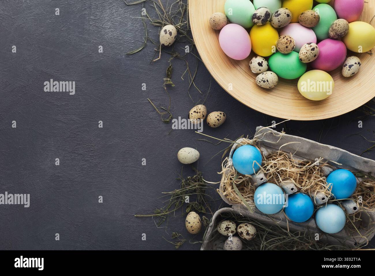 Easter background. Colored eggs on gray stone surface Stock Photo