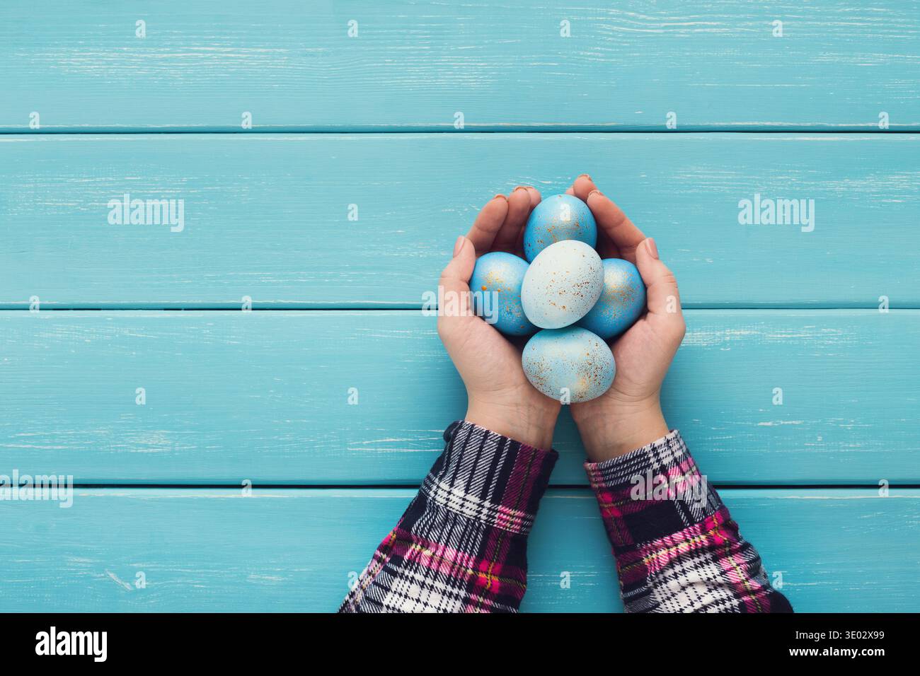 Female hand holding Easter eggs in hands Stock Photo