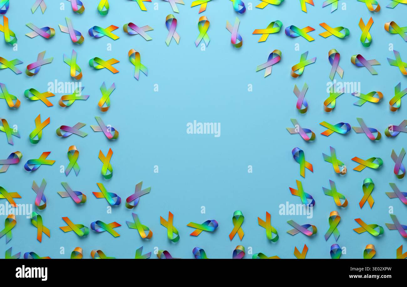 Rainbow awareness ribbons and text space space on blue background ...