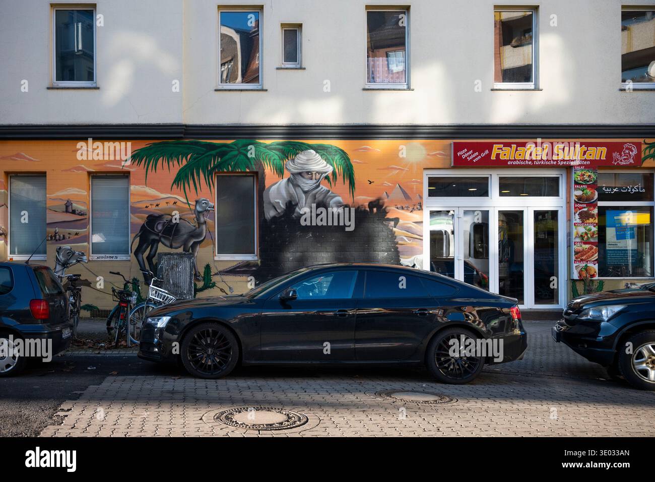 Middle Eastern arabic murals outside Falafel Sultan in Limmerstrasse, Hannover, Germany Stock Photo