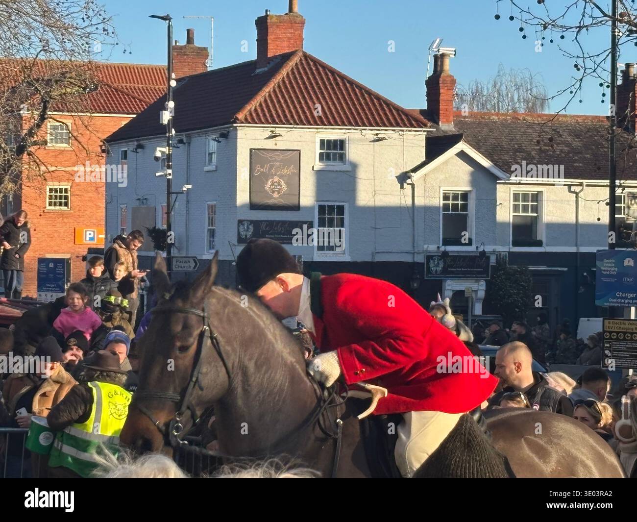 Joint Masters Of The Hunt wit female and male riders dressed in tradtional red hunting jackets and white breeches gather on horse back in front. DN10 - Smartphone Captured Stock Image