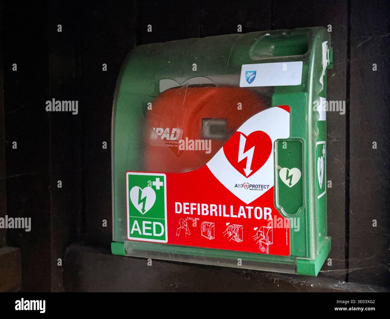 St Dogmaels, Cardiganshire, Wales, UK - 26 July 2025: AED defibrillator equipment to assist heart attack victims in a container in a bus stop - Smartphone Captured Stock Image