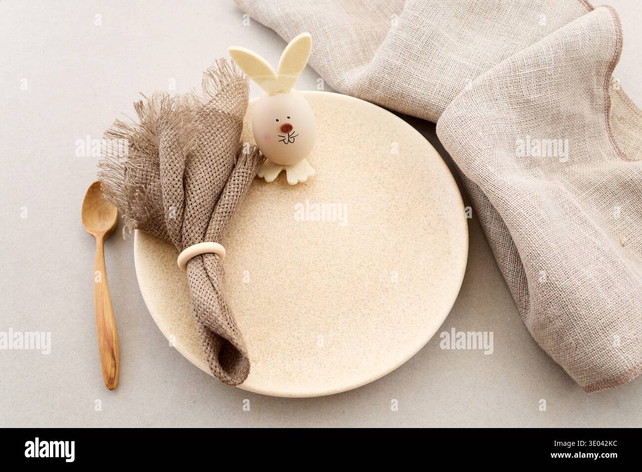 Zero waste Easter. Easter table setting with bunny egg decoration and linen napkin Stock Photo