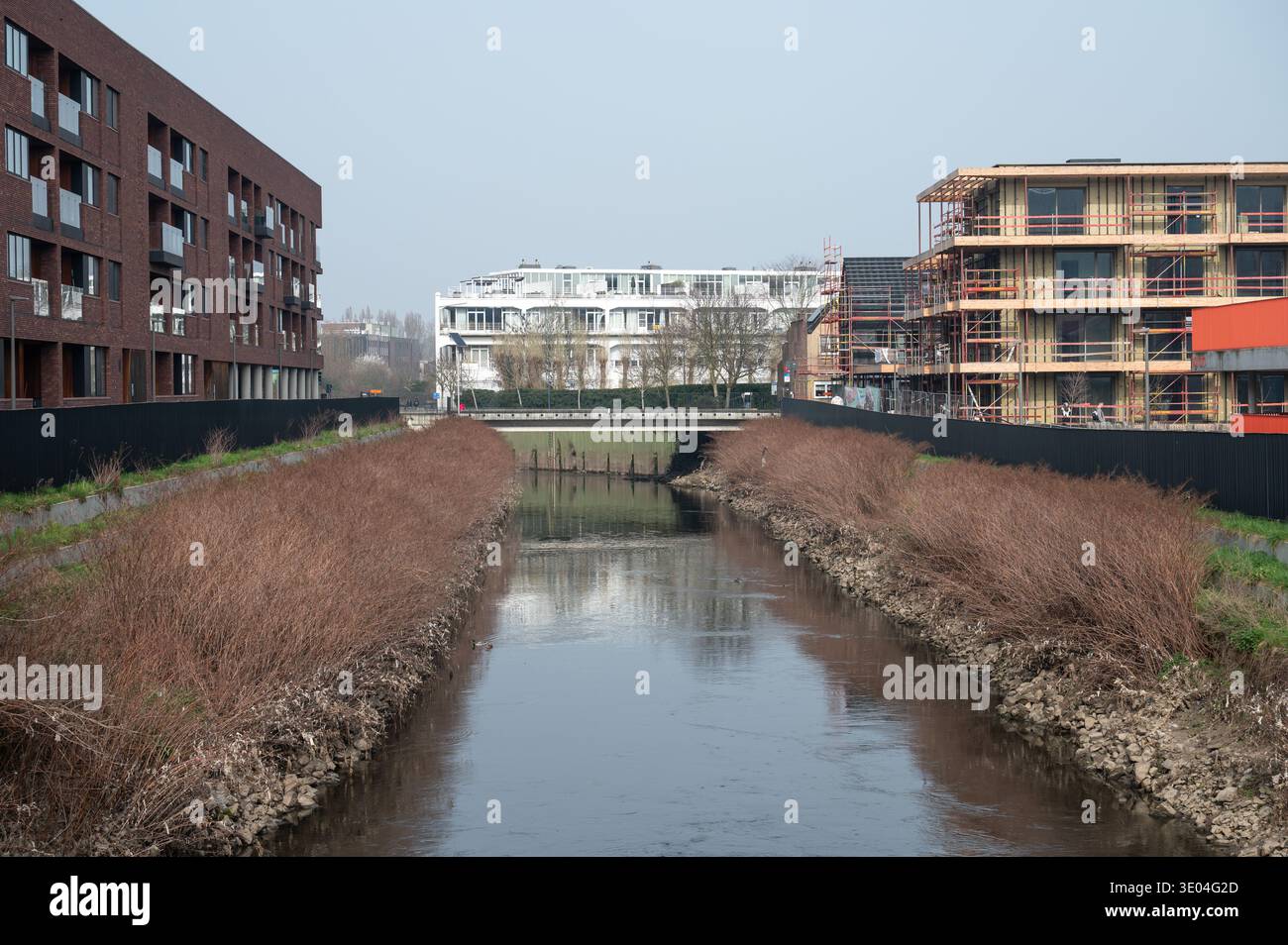 Zenne Rver Wide view over the Zenne river with newly built residential apartment ...