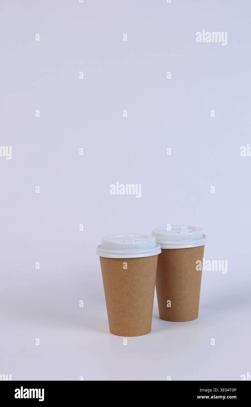 two brown cardboard glasses on a white background Stock Photo
