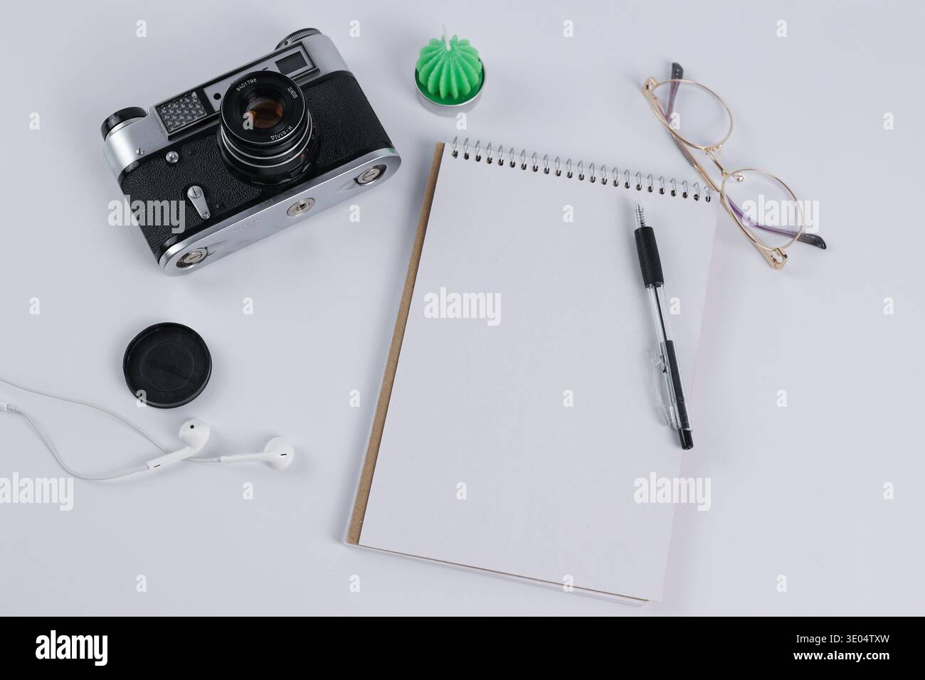 vintage camera and notebook lie on the table Stock Photo