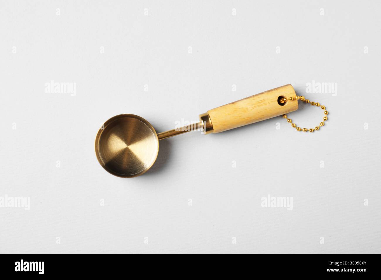 Golden scoop on light background, top view Stock Photo