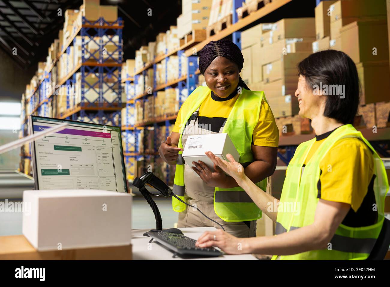 Diverse colleagues handling order hi-res stock photography and images ...