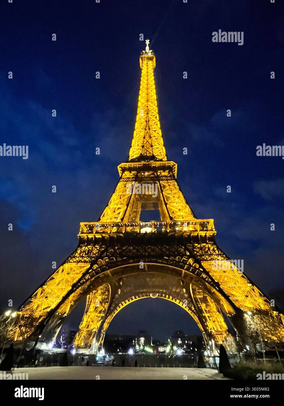 Paris, France. View of the Eiffel Tower illuminated at night. - Smartphone Captured Stock Image