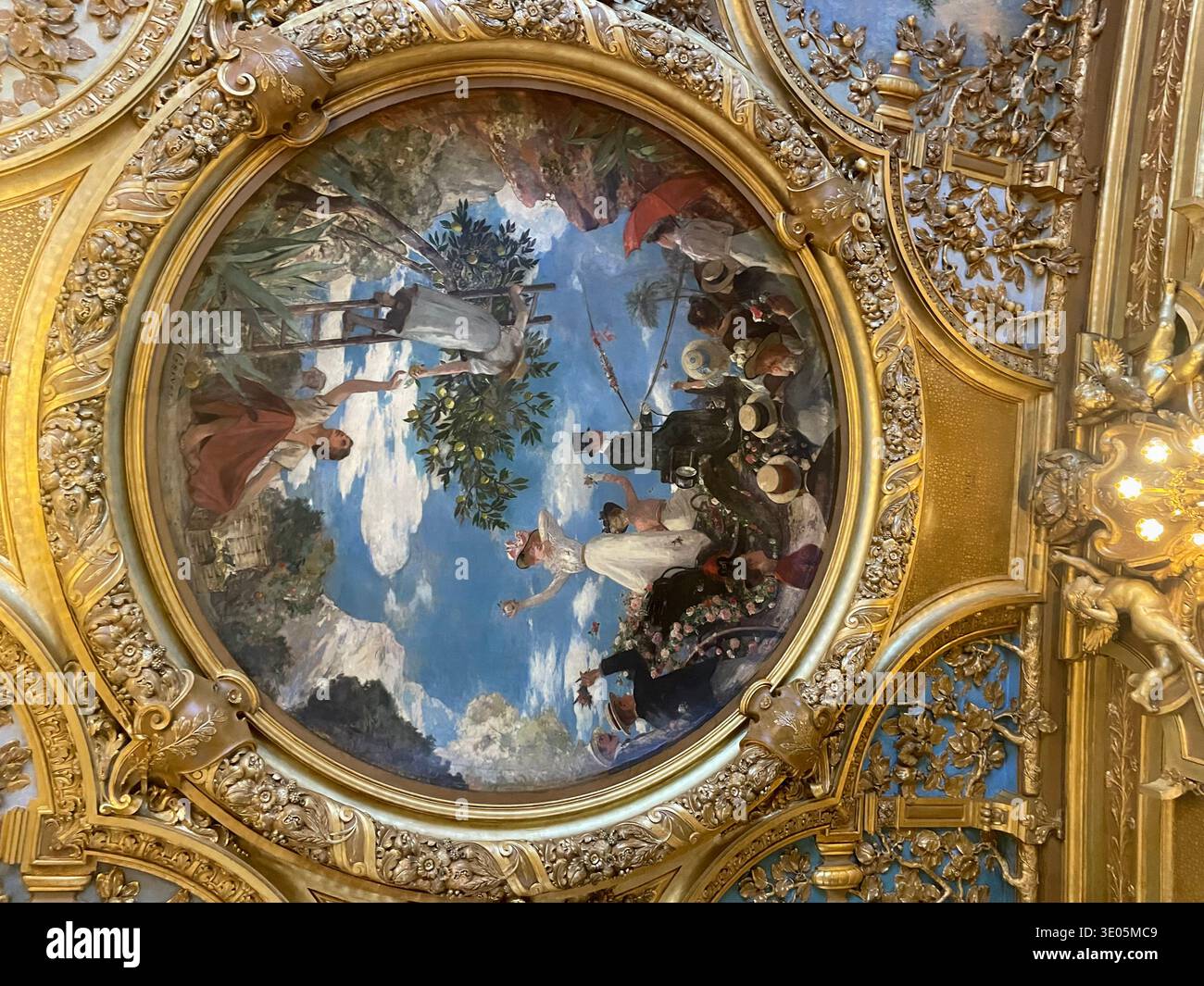 Paris, France. Interior of the restaurant Le Train Bleu inside Gare de Lyon. Detail of the ceiling fresco 'Bataille de Fleurs à Nice' by Henri Gervex. - Smartphone Captured Stock Image