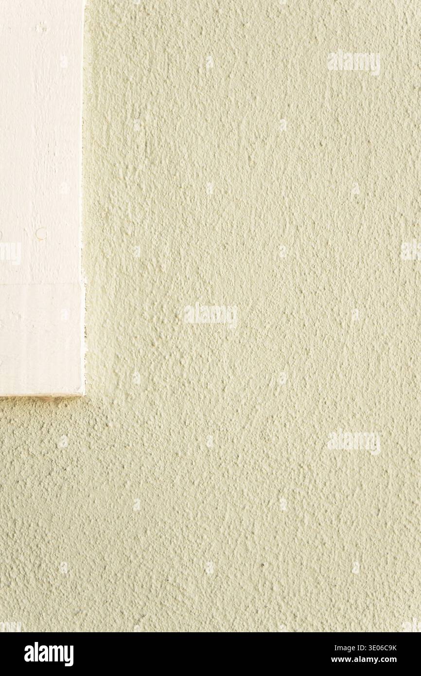 Beige stucco wall texture with white window frame minimal architectural background Stock Photo
