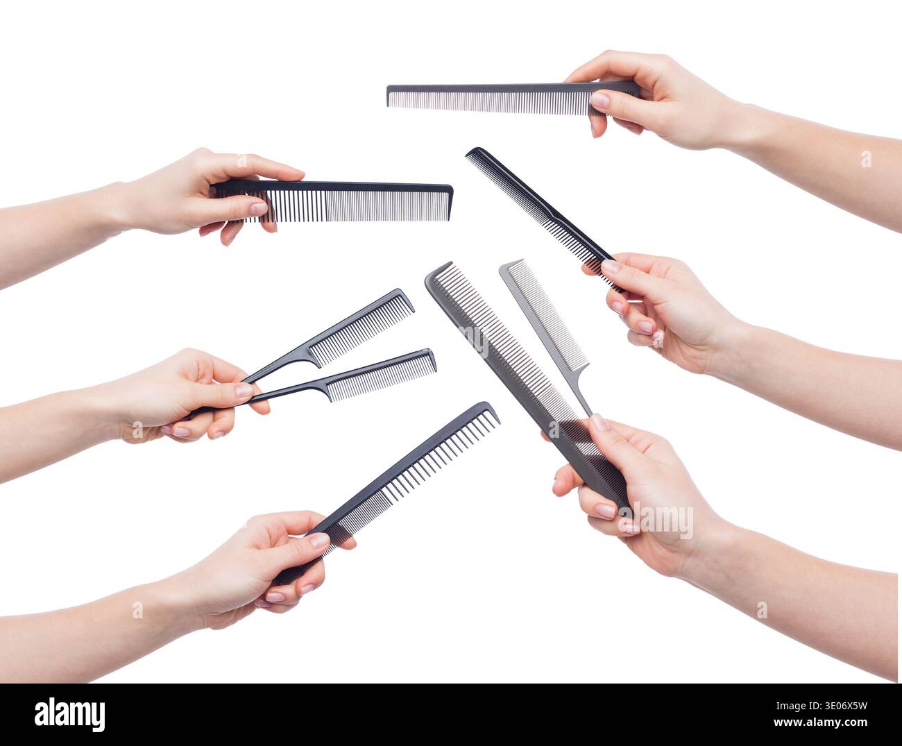 Female hands holding various combs isolated on white Stock Photo