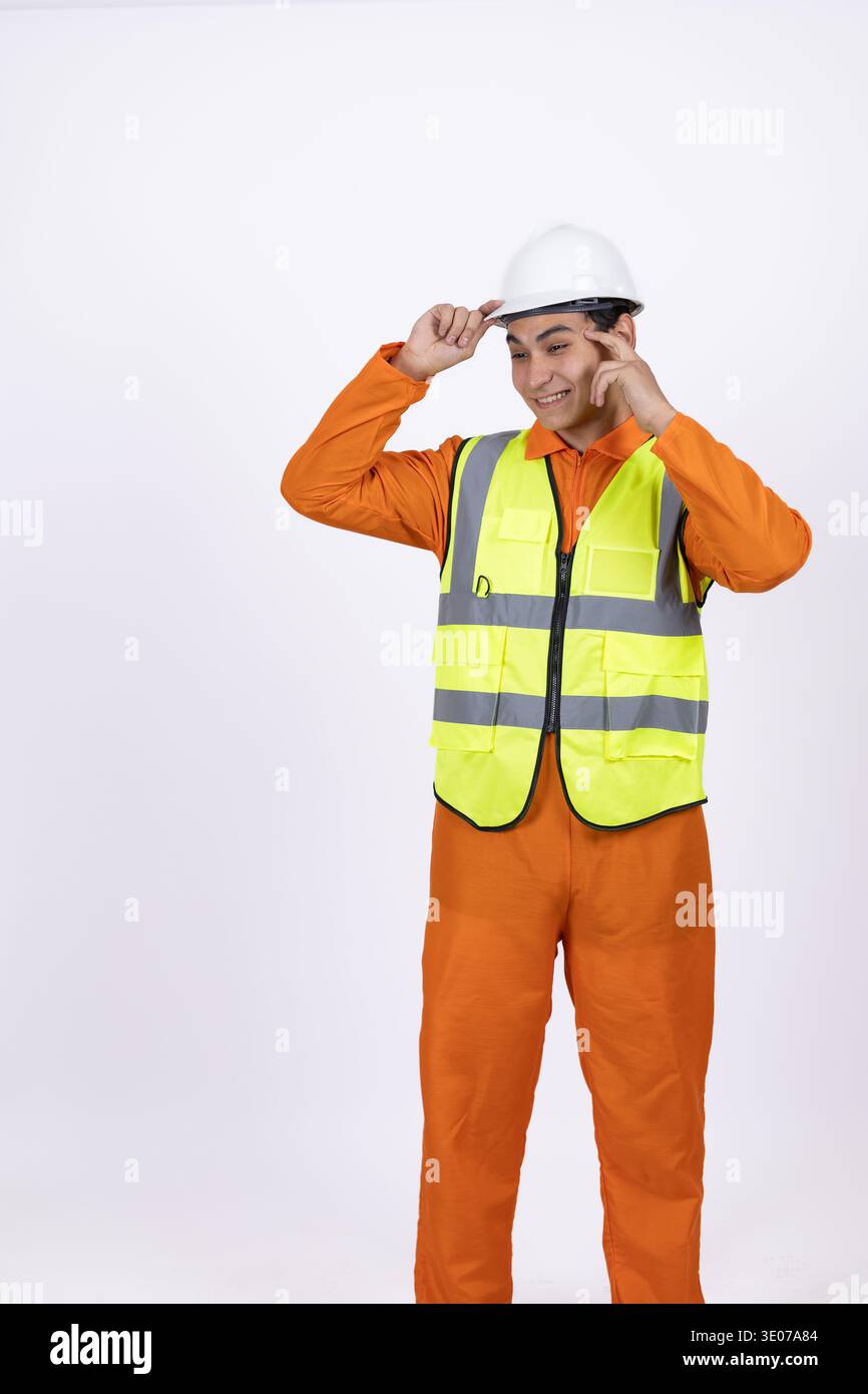 Construction worker in orange uniform and safety helmet Stock Photo