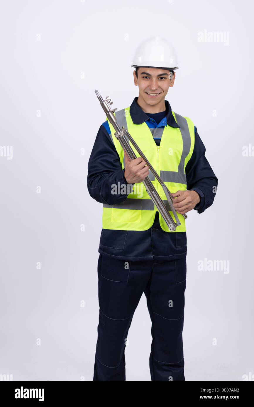Construction worker holding tools in his hands Stock Photo